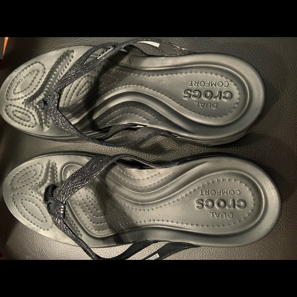 NWOT CROCS black flip flops with a little sparkle